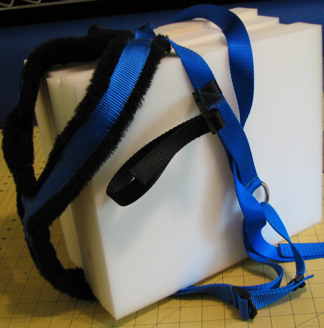 Blue dog harness with black padding