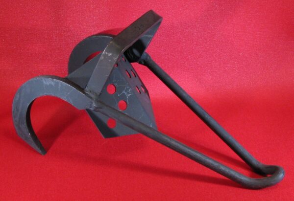 Black metal instrument against red fabric