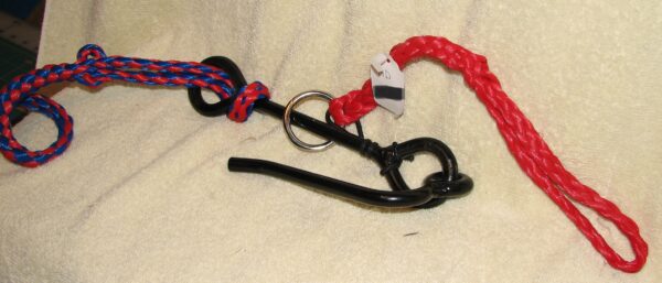 Metal hook attached to vibrant ropes.